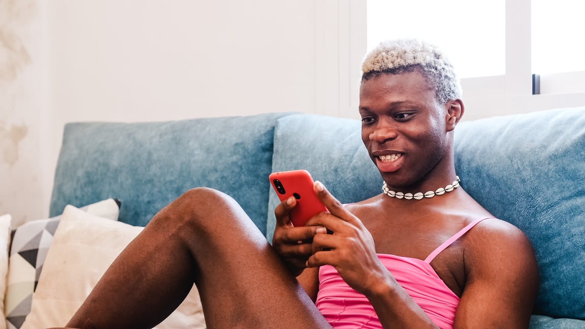 Transgender Woman Using a Phone